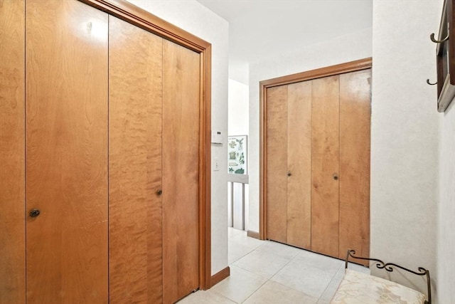 hallway with light tile patterned floors