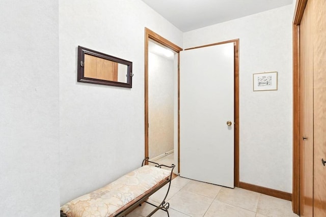 corridor with light tile patterned flooring