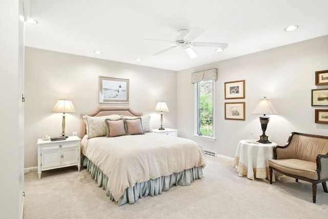 bedroom with visible vents, recessed lighting, baseboards, and light carpet