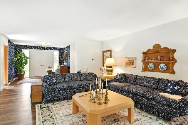 living room with baseboards and wood finished floors