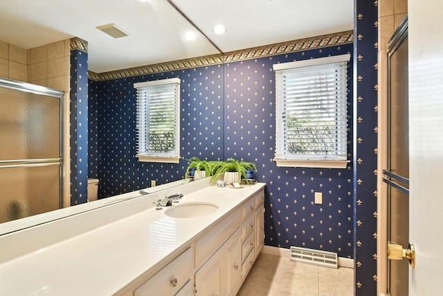 bathroom featuring visible vents, tile patterned flooring, vanity, wallpapered walls, and a shower stall