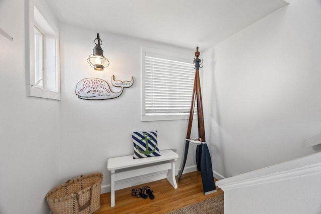 interior space featuring baseboards and wood finished floors