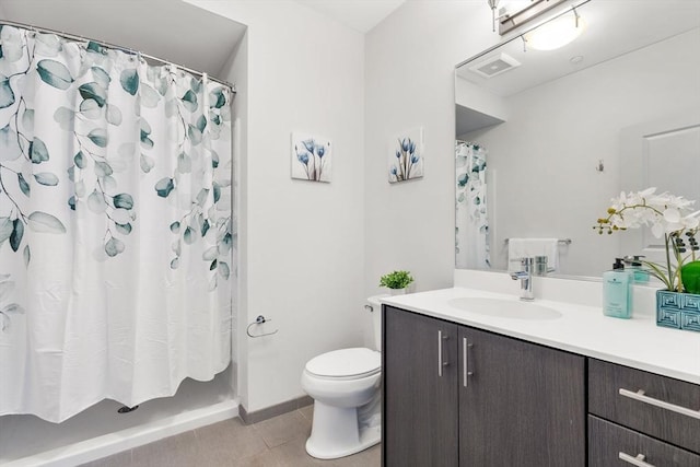 bathroom with tile patterned flooring, vanity, toilet, and a shower with curtain