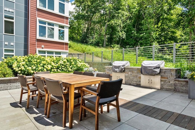 view of patio with area for grilling and exterior kitchen