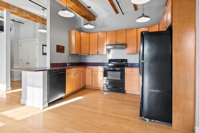 kitchen with kitchen peninsula, decorative light fixtures, black appliances, light hardwood / wood-style flooring, and beamed ceiling