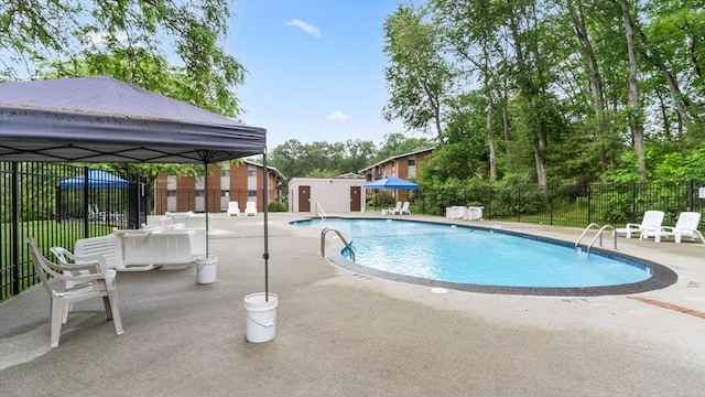 9 Longwood Dr Unit 11, Andover, MA 01810 - community pool with a patio and a storage shed
