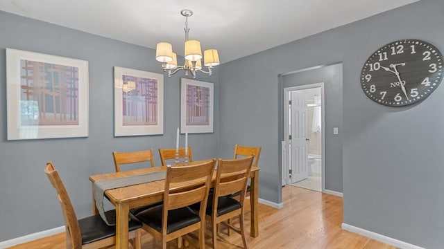9 Longwood Dr Unit 11, Andover, MA 01810 - dining area featuring a chandelier and light wood-style flooring