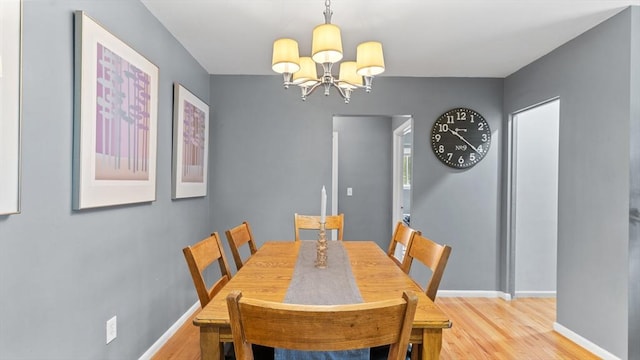 9 Longwood Dr Unit 11, Andover, MA 01810 - dining space with light wood-type flooring and a chandelier