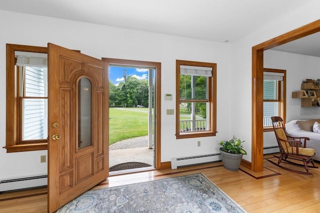 45 Pleasant St, Middleboro, MA 02346 - foyer entrance featuring a baseboard heating unit and light wood-type flooring