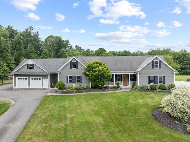 45 Pleasant St, Middleboro, MA 02346 - ranch-style house featuring covered porch, driveway, a front yard, and a garage