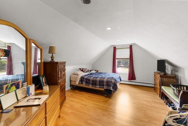 45 Pleasant St, Middleboro, MA 02346 - bedroom with a baseboard heating unit, light wood-style floors, and vaulted ceiling