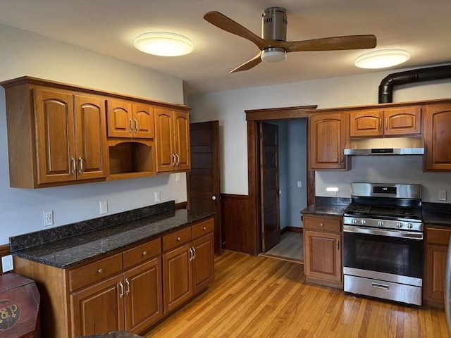 612 Grove St Lot 1, Worcester, MA 01605 - kitchen featuring stainless steel range with gas stovetop, under cabinet range hood, light wood-style floors, a ceiling fan, and dark stone counters