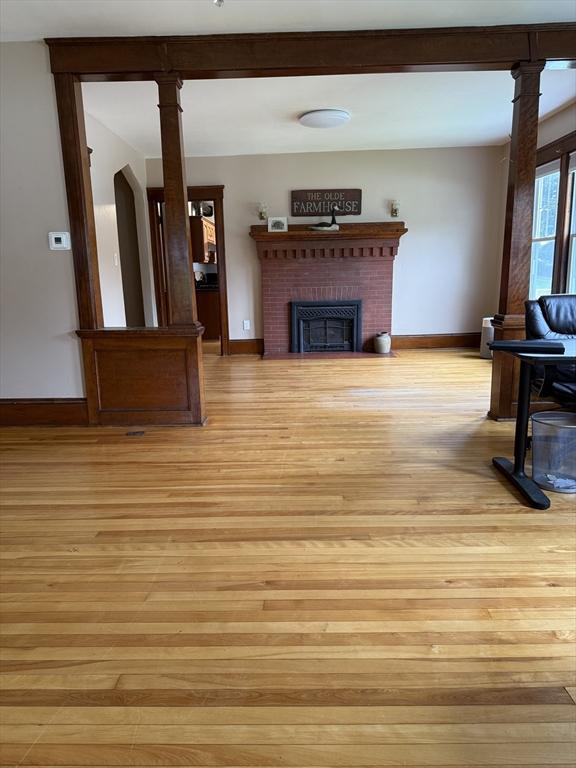 612 Grove St Lot 1, Worcester, MA 01605 - living room with light wood-type flooring, baseboards, and a fireplace