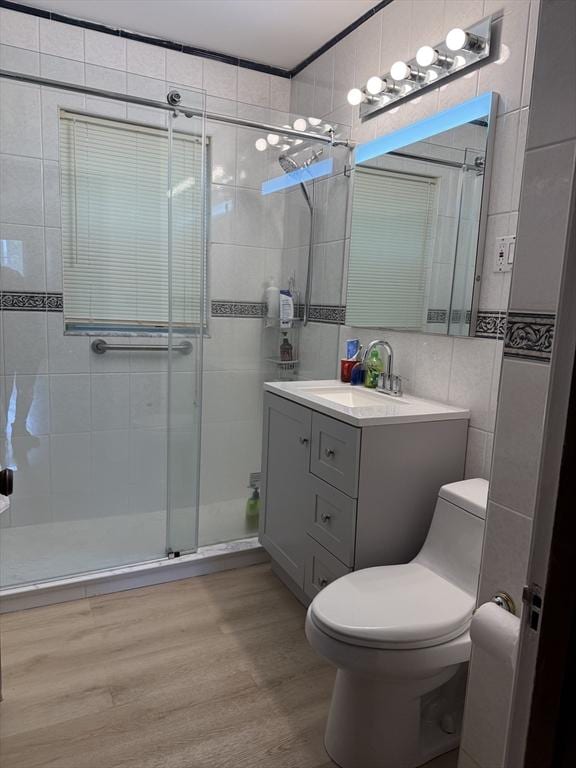 612 Grove St Lot 1, Worcester, MA 01605 - full bathroom with tile walls, toilet, a stall shower, wood finished floors, and vanity