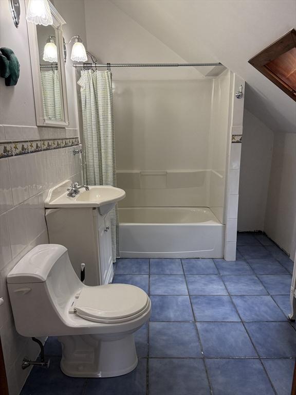 612 Grove St Lot 1, Worcester, MA 01605 - bathroom with toilet, vaulted ceiling, shower / tub combo with curtain, vanity, and tile walls