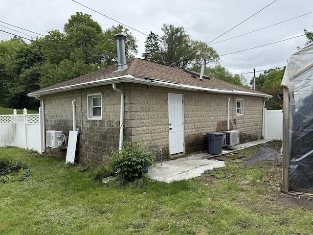 612 Grove St Lot 1, Worcester, MA 01605 - back of property featuring ac unit, a shingled roof, and central air condition unit