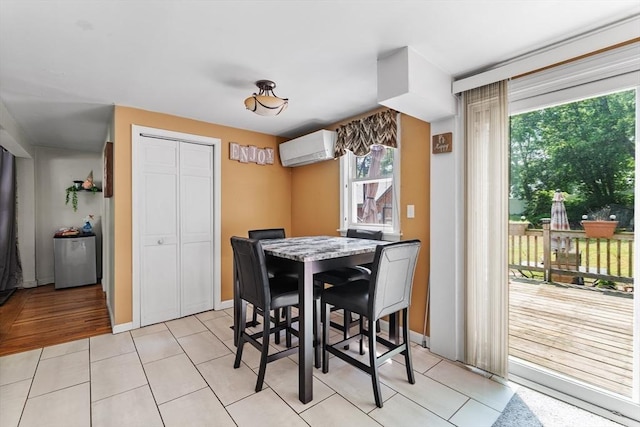 96 Hurd St, Lynn, MA 01905 - dining area featuring a wall mounted air conditioner, plenty of natural light, and light tile patterned flooring