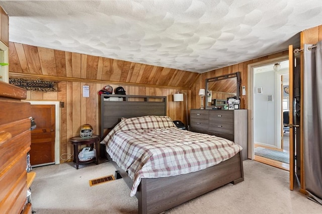 96 Hurd St, Lynn, MA 01905 - bedroom featuring light colored carpet, wooden walls, and vaulted ceiling