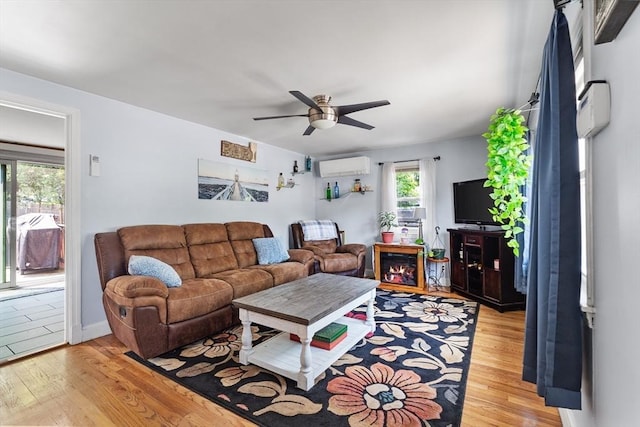 96 Hurd St, Lynn, MA 01905 - living room featuring a wall mounted air conditioner, light wood-style floors, and ceiling fan