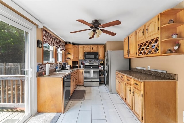 96 Hurd St, Lynn, MA 01905 - kitchen with black appliances, open shelves, a ceiling fan, light tile patterned flooring, and dark countertops