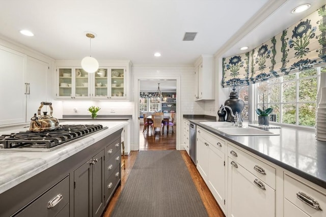 kitchen featuring visible vents, dark wood finished floors, white cabinetry, stainless steel appliances, and glass insert cabinets