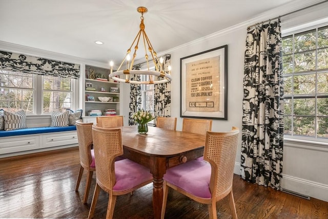 dining room with a wealth of natural light, dark wood-style flooring, and crown molding