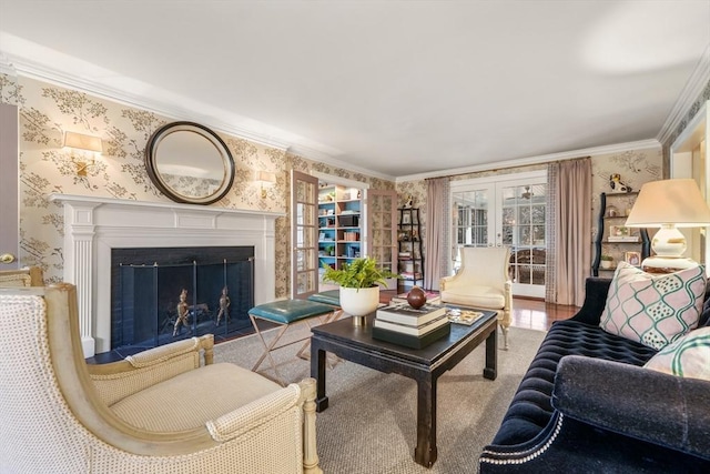 living room with french doors, wallpapered walls, a fireplace, and ornamental molding