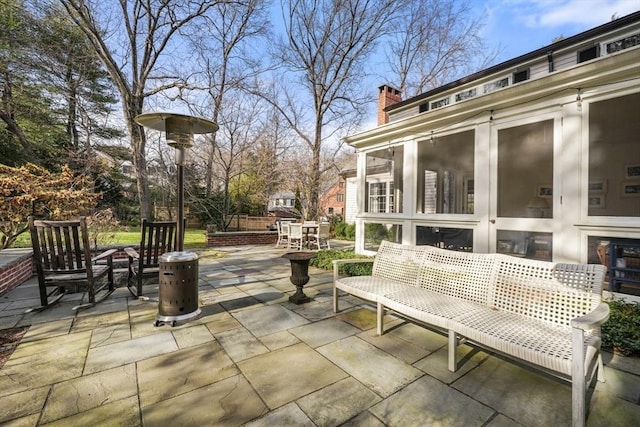 view of patio / terrace with a sunroom