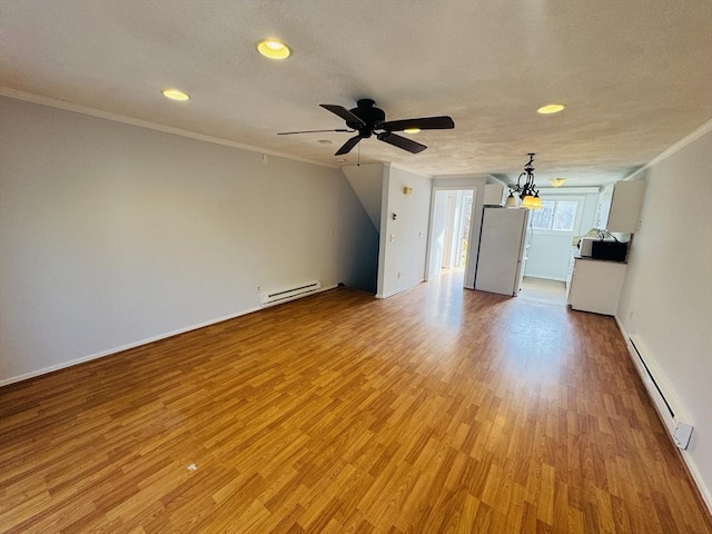 unfurnished living room featuring ornamental molding, a ceiling fan, light wood finished floors, a baseboard radiator, and baseboard heating