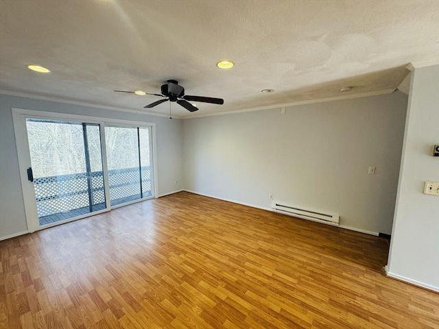 empty room with light wood-style flooring, ornamental molding, baseboards, baseboard heating, and ceiling fan