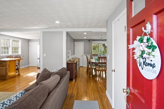 entrance foyer with wood finished floors, ceiling fan, recessed lighting, and baseboards
