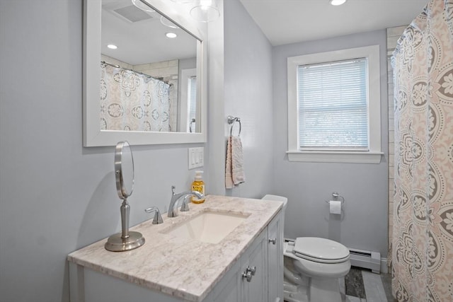 bathroom with baseboard heating, toilet, vanity, and recessed lighting