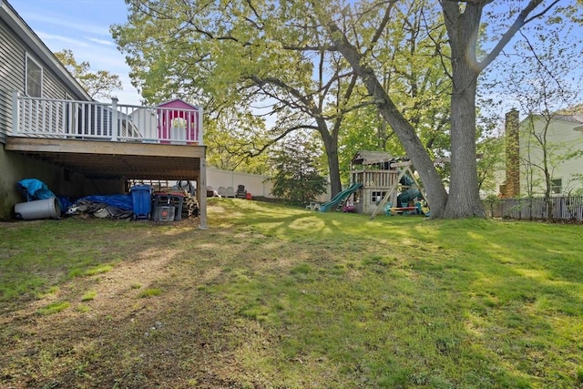 view of yard with a playground and a wooden deck