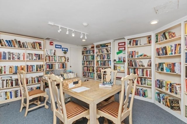 280 Boylston St Unit 110, Newton, MA 02467 - office area with wall of books, carpet floors, and rail lighting