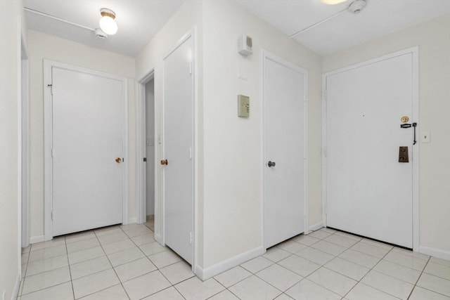 280 Boylston St Unit 110, Newton, MA 02467 - entrance foyer featuring baseboards and light tile patterned flooring