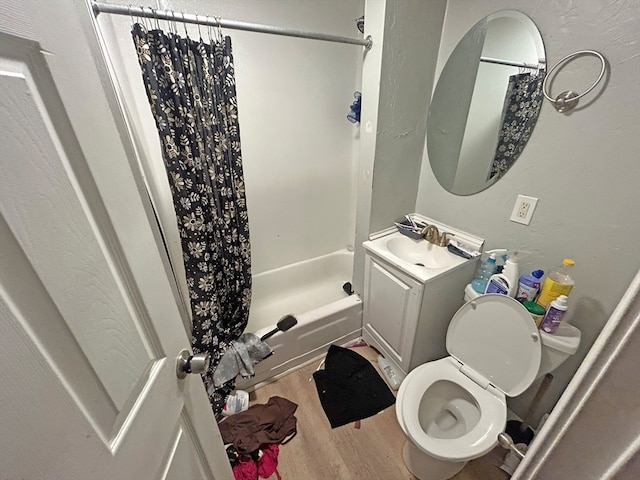 full bathroom featuring shower / bath combo, toilet, wood-type flooring, and vanity