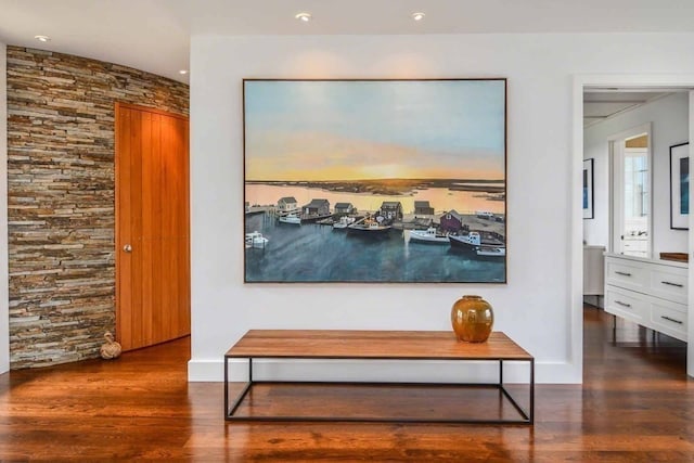 hall with dark hardwood / wood-style flooring