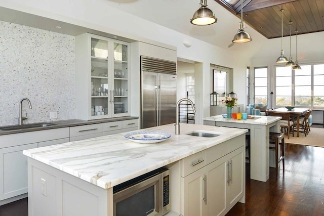 kitchen featuring a center island with sink, stainless steel appliances, and sink