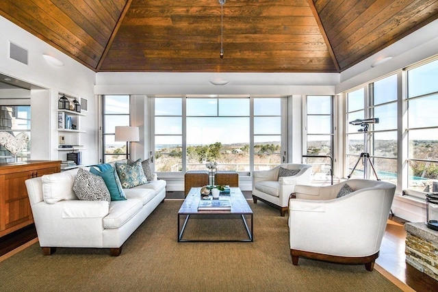 sunroom featuring wood ceiling and vaulted ceiling