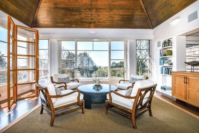 sunroom / solarium featuring lofted ceiling and wooden ceiling