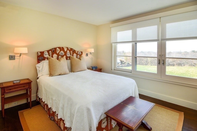 bedroom featuring dark wood-type flooring