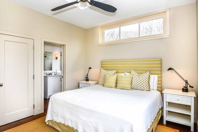 bedroom with ceiling fan, dark hardwood / wood-style floors, and ensuite bathroom