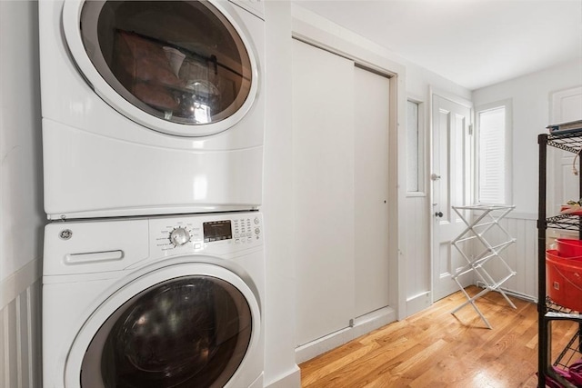 14 Horace St Unit 2, Boston, MA 02128 - laundry area with stacked washer / dryer and light wood-style floors