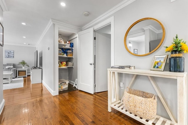 138 Dartmouth St, Everett, MA 02149 - hallway with recessed lighting, wood finished floors, ornamental molding, a baseboard heating unit, and baseboards
