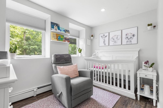138 Dartmouth St, Everett, MA 02149 - bedroom featuring a baseboard heating unit, multiple windows, wood finished floors, and recessed lighting