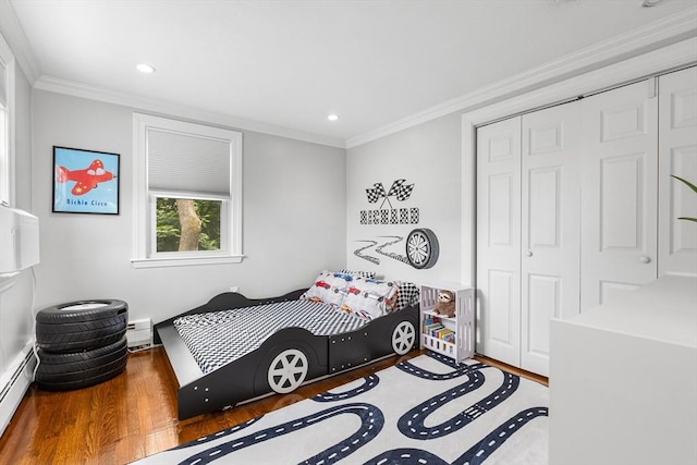 138 Dartmouth St, Everett, MA 02149 - bedroom with a closet, wood finished floors, baseboard heating, ornamental molding, and recessed lighting