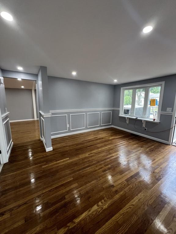 empty room with dark hardwood / wood-style floors