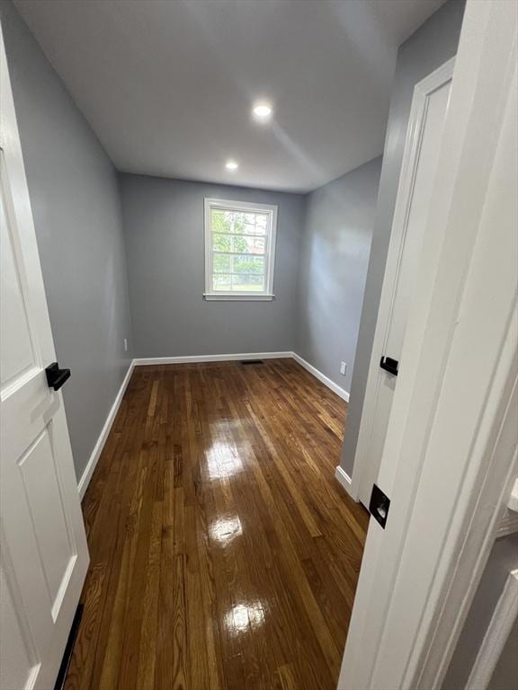 empty room with dark hardwood / wood-style floors