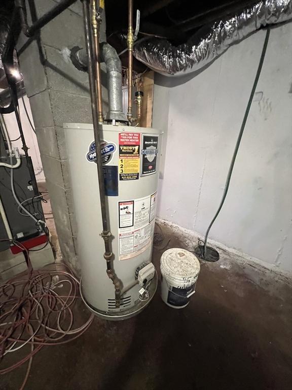 utility room with water heater