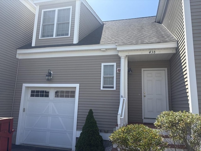 43 Longview Cir Unit B, Ayer, MA 01432 - doorway to property with an attached garage and roof with shingles